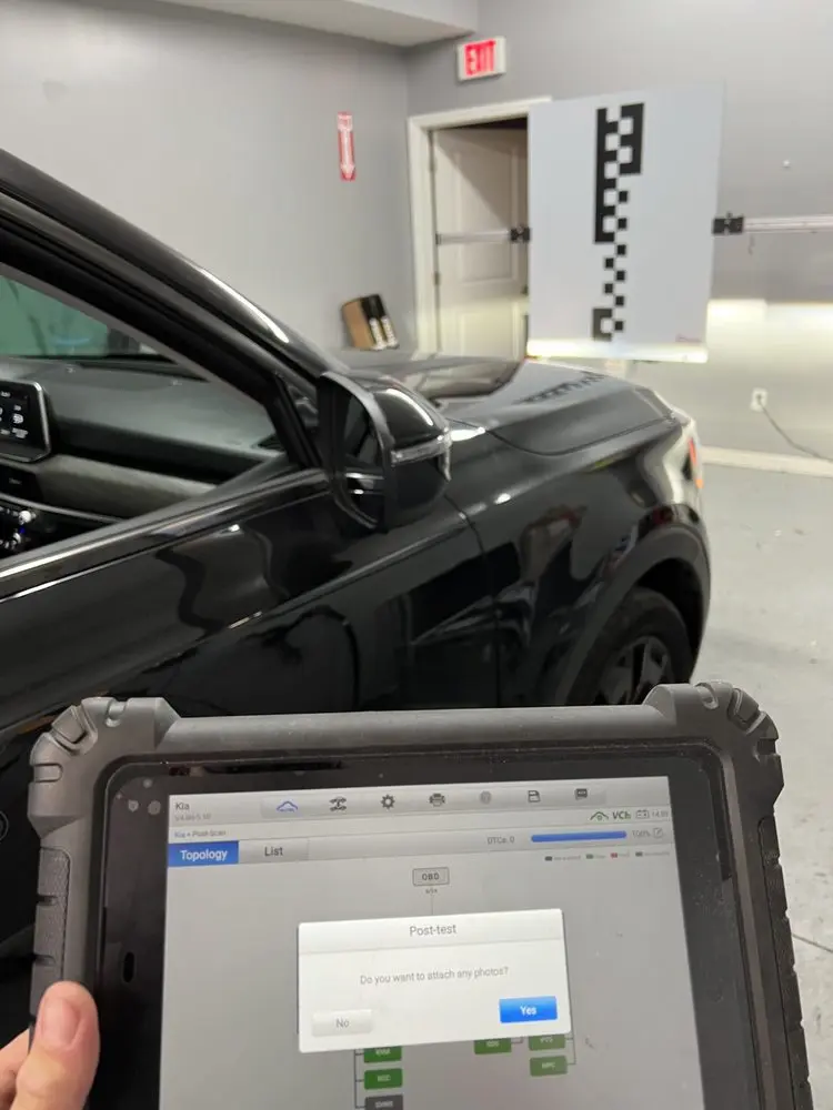 Technician conducting post-installation test on vehicle in Freehold, ensuring quality auto services at Master Auto Glass.