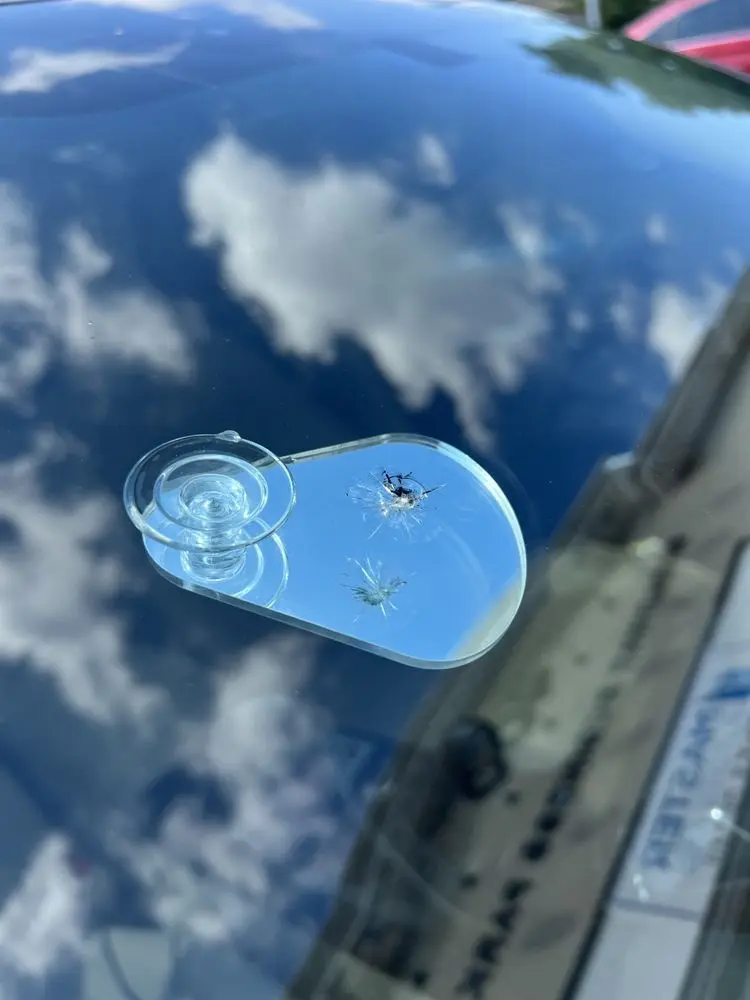 Small chip on windshield showing early signs for possible replacement