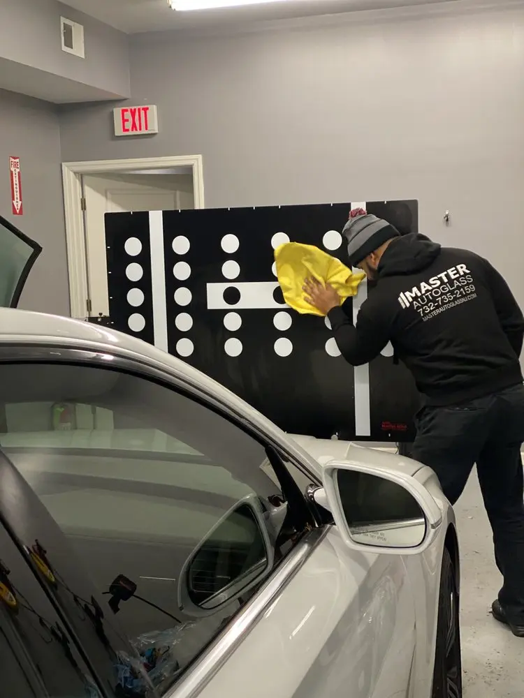 ADAS recalibration setup during professional auto glass installation
